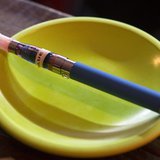 An e-cigarette sits in a tray on the bar at the Henley Vaporium in New York City December 18, 2013. REUTERS/Mike Segar An e-cigarette sits in a tray on the bar at the Henley Vaporium in New York City December 18, 2013. REUTERS/Mike Segar