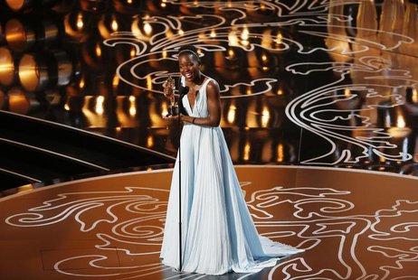 Lupita Nyong'o, best supporting actress winner for her role in "12 Years a Slave", reacts on stage at the 86th Academy Awards in Hollywood, Lupita Nyong'o, best supporting actress winner for her role in "12 Years a Slave", reacts on stage at the 86th Academy Awards in Hollywood,