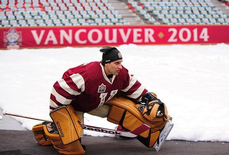 Mar 1, 2014; Vancouver, BC, Canada; Vancouver Canucks goaltender Roberto Luongo (1) warms up off ice during practice the day before the Heri Mar 1, 2014; Vancouver, BC, Canada; Vancouver Canucks goaltender Roberto Luongo (1) warms up off ice during practice the day before the Heri