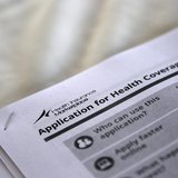 The federal government forms for applying for health coverage are seen at a rally held by supporters of the Affordable Care Act, widely refe The federal government forms for applying for health coverage are seen at a rally held by supporters of the Affordable Care Act, widely refe