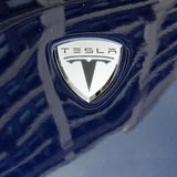 A logo of Tesla Motors on an electric car model is seen outside a showroom in New York June 28, 2010. REUTERS/Shannon Stapleton A logo of Tesla Motors on an electric car model is seen outside a showroom in New York June 28, 2010. REUTERS/Shannon Stapleton