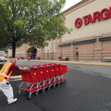 A Target employee returns carts to the store in Falls Church, Virginia May 14, 2012. REUTERS/Kevin Lamarque A Target employee returns carts to the store in Falls Church, Virginia May 14, 2012. REUTERS/Kevin Lamarque