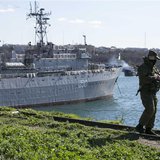 A Russian soldier stands guard near Ukrainian navy command ship Slavutych at the Crimean port of Sevastopol March 5, 2014. REUTERS/Baz Ratne A Russian soldier stands guard near Ukrainian navy command ship Slavutych at the Crimean port of Sevastopol March 5, 2014. REUTERS/Baz Ratne