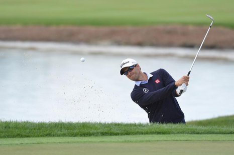 Adam Scott hits out of a bunker on the 18th hole during the second round of the Honda Classic at PGA National GC Champion Course. Mandatory Adam Scott hits out of a bunker on the 18th hole during the second round of the Honda Classic at PGA National GC Champion Course. Mandatory