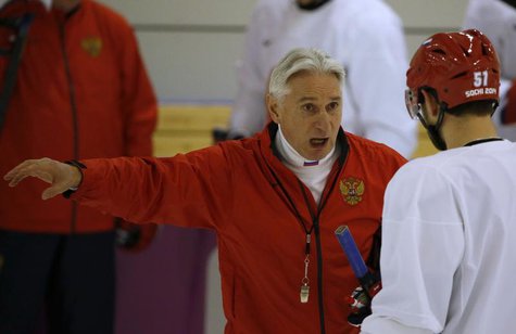 Russia's men's ice hockey coach Zinetula Bilyaletdinov (C) talks to players during a team practice at the 2014 Sochi Winter Olympics, Februa Russia's men's ice hockey coach Zinetula Bilyaletdinov (C) talks to players during a team practice at the 2014 Sochi Winter Olympics, Februa