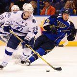 Mar 4, 2014; St. Louis, MO, USA; Tampa Bay Lightning right wing Martin St. Louis (26) skates with the puck against the St. Louis Blues durin Mar 4, 2014; St. Louis, MO, USA; Tampa Bay Lightning right wing Martin St. Louis (26) skates with the puck against the St. Louis Blues durin
