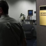 A man walks past a doorway at the Fort Worth Regional Office of the Securities and Exchange Commission (SEC) in Fort Worth, Texas June 28, 2 A man walks past a doorway at the Fort Worth Regional Office of the Securities and Exchange Commission (SEC) in Fort Worth, Texas June 28, 2