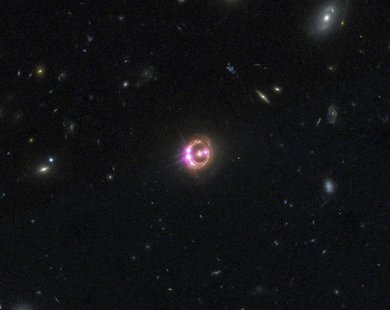 Multiple images of a distant quasar are visible in this undated combined view from NASA’s Chandra X-ray Observatory and the Hubble Space Tel Multiple images of a distant quasar are visible in this undated combined view from NASA’s Chandra X-ray Observatory and the Hubble Space Tel