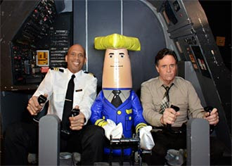 "Roger Murdock" (Kareem Abdul-Jabbar), "Ted Striker" (Robert Hays) and Otto Pilot in the original “Airplane!” cockpit during the shoot of the new aerial ads for the Wisconsin Department of Tourism. PHOTO: Wis. Department of Tourism
"Roger Murdock" (Kareem Abdul-Jabbar), "Ted Striker" (Robert Hays) and Otto Pilot in the original “Airplane!” cockpit during the shoot of the new aerial ads for the Wisconsin Department of Tourism. PHOTO: Wis. Department of Tourism