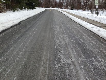 A road in with salt brine sprayed and dried on the surface in anticipation of a snow storm.(Photo from: Z22/Creative Commons). A road in with salt brine sprayed and dried on the surface in anticipation of a snow storm.(Photo from: Z22/Creative Commons).