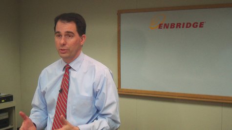 Wisconsin Governor Scott Walker (R) talks with reporters following a tour of the Enbridge Tank site in Superior Wisconsin Governor Scott Walker (R) talks with reporters following a tour of the Enbridge Tank site in Superior