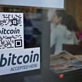 Signs on window advertise a bitcoin ATM machine that has been installed in a Waves Coffee House in Vancouver, British Columbia October 28, 2 Signs on window advertise a bitcoin ATM machine that has been installed in a Waves Coffee House in Vancouver, British Columbia October 28, 2