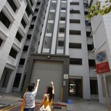 A resident (L) shows where she said the body of Autumn Radkte, chief executive of First Meta Pte Ltd, was found on the second floor of a pub A resident (L) shows where she said the body of Autumn Radkte, chief executive of First Meta Pte Ltd, was found on the second floor of a pub