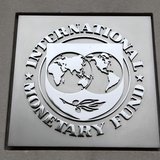 The International Monetary Fund (IMF) logo is seen at the IMF headquarters building during the 2013 Spring Meeting of the International Mone The International Monetary Fund (IMF) logo is seen at the IMF headquarters building during the 2013 Spring Meeting of the International Mone
