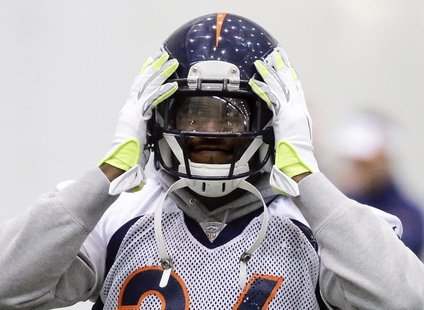 Denver Broncos cornerback Champ Bailey adjusts his helmet during their practice session for the Super Bowl at the New York Jets Training Cen Denver Broncos cornerback Champ Bailey adjusts his helmet during their practice session for the Super Bowl at the New York Jets Training Cen
