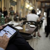 A man poses with his iPad tablet as he sits in a bar, in this photo illustration taken in Rome September 20, 2012. REUTERS/Tony Gentile A man poses with his iPad tablet as he sits in a bar, in this photo illustration taken in Rome September 20, 2012. REUTERS/Tony Gentile