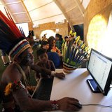 Brazilian indigenous people use computers inside a tent during the XII Games of the Indigenous People in Cuiaba November 13, 2013. REUTERS/P Brazilian indigenous people use computers inside a tent during the XII Games of the Indigenous People in Cuiaba November 13, 2013. REUTERS/P