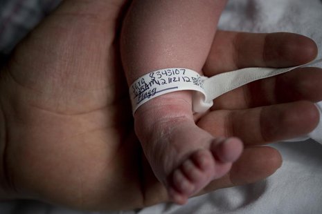 Dale Smith holds the foot of his newborn baby Sofia Murchison-Smith, born at 6:25 am, at the New York Downtown Hospital in New York December Dale Smith holds the foot of his newborn baby Sofia Murchison-Smith, born at 6:25 am, at the New York Downtown Hospital in New York December
