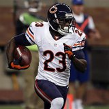 Chicago Bears wide receiver Devin Hester carries the ball against the Detroit Lions during the first half of their NFL football game in Detr Chicago Bears wide receiver Devin Hester carries the ball against the Detroit Lions during the first half of their NFL football game in Detr