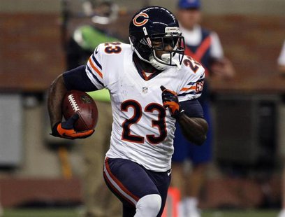 Chicago Bears wide receiver Devin Hester carries the ball against the Detroit Lions during the first half of their NFL football game in Detr Chicago Bears wide receiver Devin Hester carries the ball against the Detroit Lions during the first half of their NFL football game in Detr