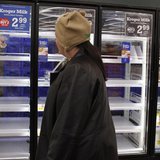 A shopper passes by mostly empty refrigerator of milk at a grocery store in Lilburn, Georgia, February 12, 2014. REUTERS/Tami Chappell A shopper passes by mostly empty refrigerator of milk at a grocery store in Lilburn, Georgia, February 12, 2014. REUTERS/Tami Chappell