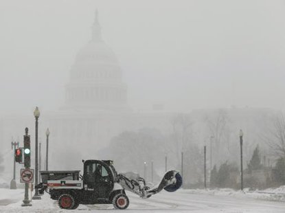 A snow sweeper attempts to keep a street open in front of the U.S. Capitol during a blizzard in Washington March 3, 2014.
CREDIT: REUTERS/GARY CAMERON A snow sweeper attempts to keep a street open in front of the U.S. Capitol during a blizzard in Washington March 3, 2014.
CREDIT: REUTERS/GARY CAMERON