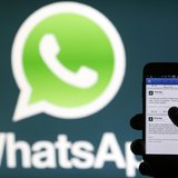 A Whatsapp App logo is seen behind a Samsung Galaxy S4 phone that is logged on to Facebook in the central Bosnian town of Zenica, February 2 A Whatsapp App logo is seen behind a Samsung Galaxy S4 phone that is logged on to Facebook in the central Bosnian town of Zenica, February 2