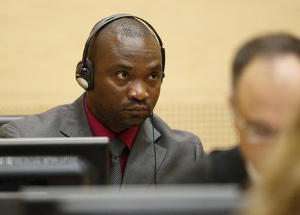 Germain Katanga, a Congolese national, sits in the courtroom of the ICC during the closing statements in the trial against Katanga and Ngudj Germain Katanga, a Congolese national, sits in the courtroom of the ICC during the closing statements in the trial against Katanga and Ngudj