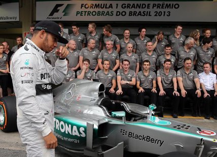 Mercedes Formula One drivers Lewis Hamilton of Britain arrive to pose with team members at the Interlagos circuit in Sao Paulo November 24, Mercedes Formula One drivers Lewis Hamilton of Britain arrive to pose with team members at the Interlagos circuit in Sao Paulo November 24,