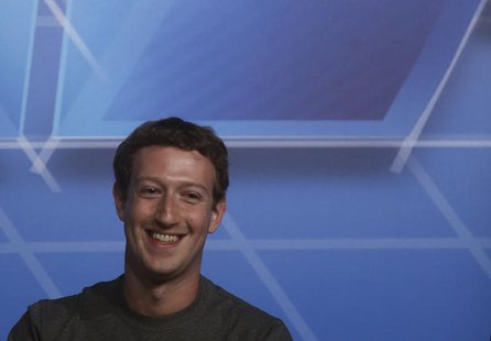 Facebook Chief Executive Officer Mark Zuckerberg smiles in the stage before delivering a keynote speech during the Mobile World Congress in Facebook Chief Executive Officer Mark Zuckerberg smiles in the stage before delivering a keynote speech during the Mobile World Congress in