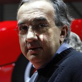 Fiat CEO Sergio Marchionne poses after the presentation of the new LaFerrari hybrid car on the Ferrari stand during the first media day of t Fiat CEO Sergio Marchionne poses after the presentation of the new LaFerrari hybrid car on the Ferrari stand during the first media day of t