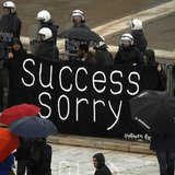Workers, who lost their jobs recently, hold a banner outside the parliament during an anti-austerity protest in Athens November 6, 2013. REU Workers, who lost their jobs recently, hold a banner outside the parliament during an anti-austerity protest in Athens November 6, 2013. REU