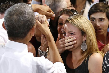 A woman cries while meeting U.S. President Barack Obama at the Coral Reef High School in Miami, Florida, March 7, 2014. REUTERS/Yuri Gripas A woman cries while meeting U.S. President Barack Obama at the Coral Reef High School in Miami, Florida, March 7, 2014. REUTERS/Yuri Gripas