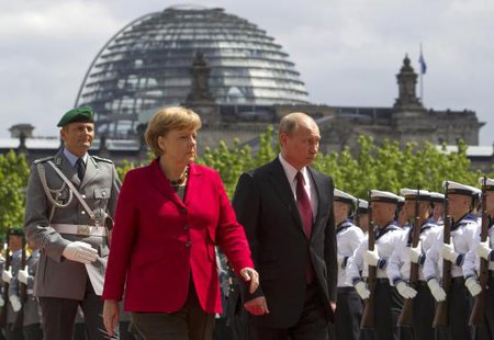 German Chancellor Angela Merkel (2nd R) and Russian President Vladimir Putin (R) inspect the honour guards before talks at the Chancellery in Berlin in this June 1, 2012 file picture.
CREDIT: REUTERS/THOMAS PETER/FILES German Chancellor Angela Merkel (2nd R) and Russian President Vladimir Putin (R) inspect the honour guards before talks at the Chancellery in Berlin in this June 1, 2012 file picture.
CREDIT: REUTERS/THOMAS PETER/FILES