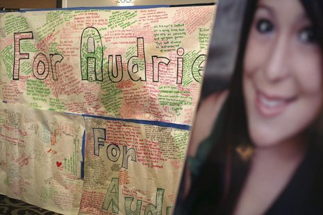 A message board and portrait of Audrie Pott are shown at a news conference in San Jose, California April 15, 2013. REUTERS/Robert Galbraith A message board and portrait of Audrie Pott are shown at a news conference in San Jose, California April 15, 2013. REUTERS/Robert Galbraith