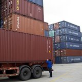 An employee takes notes at a port of Shanghai Free Trade Zone, February 11, 2014. REUTERS/Aly Song An employee takes notes at a port of Shanghai Free Trade Zone, February 11, 2014. REUTERS/Aly Song