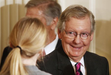U.S.Sen. Mitch McConnell (R-KY) walks out after President Barack Obama announced the first five "Promise Zones" as promised in last year's S U.S.Sen. Mitch McConnell (R-KY) walks out after President Barack Obama announced the first five "Promise Zones" as promised in last year's S