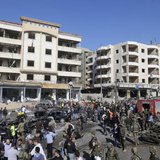 Civil defence members, army soldiers and police officers gather at the site of an explosion near Iran's cultural centre in the southern subu Civil defence members, army soldiers and police officers gather at the site of an explosion near Iran's cultural centre in the southern subu