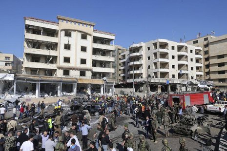 Civil defence members, army soldiers and police officers gather at the site of an explosion near Iran's cultural centre in the southern subu Civil defence members, army soldiers and police officers gather at the site of an explosion near Iran's cultural centre in the southern subu