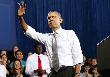 U.S. President Barack Obama waves during a visit to Coral Reef High School in Miami, Florida, March 7, 2014. REUTERS/Yuri Gripas U.S. President Barack Obama waves during a visit to Coral Reef High School in Miami, Florida, March 7, 2014. REUTERS/Yuri Gripas