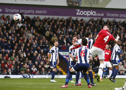Manchester United's Phil Jones (R) scores a goal against West Bromwich Albion during their English Premier League soccer match at The Hawtho Manchester United's Phil Jones (R) scores a goal against West Bromwich Albion during their English Premier League soccer match at The Hawtho
