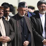 Afghan President Hamid Karzai (C) and Vice Presidents Mohammad Qasim Fahim (L) and Karim Khalili attend the funeral ceremony of slain former Afghan President Hamid Karzai (C) and Vice Presidents Mohammad Qasim Fahim (L) and Karim Khalili attend the funeral ceremony of slain former