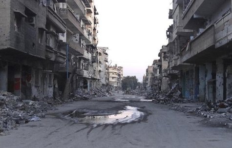 A general view shows a deserted street filled with debris of damaged buildings in Deir al-Zor March 5, 2014. REUTERS/Stringer A general view shows a deserted street filled with debris of damaged buildings in Deir al-Zor March 5, 2014. REUTERS/Stringer