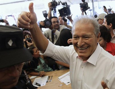 Salvador Sanchez Ceren, the presidential candidate for the Farabundo Marti Front for National Liberation (FMLN), gestures after casting his Salvador Sanchez Ceren, the presidential candidate for the Farabundo Marti Front for National Liberation (FMLN), gestures after casting his