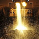 A labourer guides as slag is poured into a container at Dongbei Special Steel Group Co. Ltd. in Dalian, Liaoning province December 27, 2013. A labourer guides as slag is poured into a container at Dongbei Special Steel Group Co. Ltd. in Dalian, Liaoning province December 27, 2013.