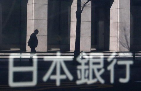 A man walking past a building is reflected in a sign board of the Bank of Japan building in Tokyo January 22, 2014. REUTERS/Yuya Shino A man walking past a building is reflected in a sign board of the Bank of Japan building in Tokyo January 22, 2014. REUTERS/Yuya Shino