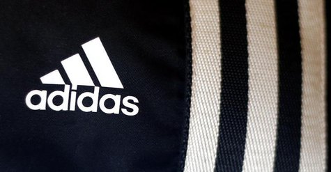 The logo of Adidas, the world's second largest sports apparel firm, is pictured in a store in Munich March 4, 2014. REUTERS/Michael Dalder The logo of Adidas, the world's second largest sports apparel firm, is pictured in a store in Munich March 4, 2014. REUTERS/Michael Dalder