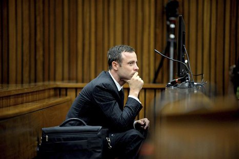 Olympic and Paralympic track star Oscar Pistorius listens to a witness testifying at the North Gauteng High Court in Pretoria March 10, 2014 Olympic and Paralympic track star Oscar Pistorius listens to a witness testifying at the North Gauteng High Court in Pretoria March 10, 2014