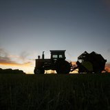 A tractor is silhouetted on a hillside in Prairie City, Iowa, November 16, 2007. REUTERS/Shannon Stapleton A tractor is silhouetted on a hillside in Prairie City, Iowa, November 16, 2007. REUTERS/Shannon Stapleton