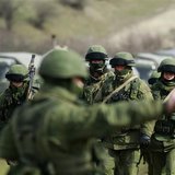Armed men, believed to be Russian servicemen, march outside an Ukrainian military base in the village of Perevalnoye near the Crimean city o Armed men, believed to be Russian servicemen, march outside an Ukrainian military base in the village of Perevalnoye near the Crimean city o
